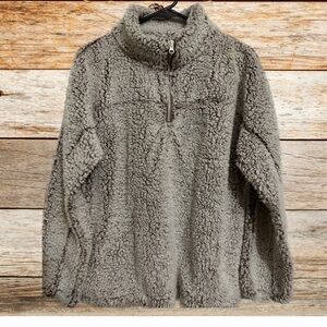 Indulge in the comfortable & welcoming warmth of a gentle rose-colored pullover